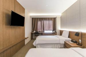 Hotel Elora客房内的一张或多张床位