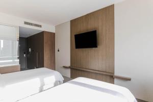Hotel Elora客房内的一张或多张床位