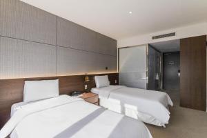 Hotel Elora客房内的一张或多张床位
