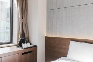 Hotel Elora客房内的一张或多张床位