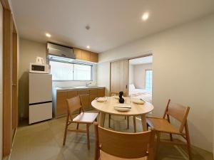 a kitchen and dining room with a table and chairs at Celine Kanayama Building in Hiroshima +21 photos