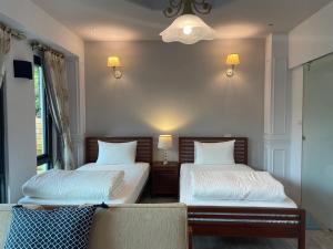 Postel nebo postele na pokoji v ubytování Spring Land Villa & 白舍青丘