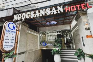 a nocasan hotel with a sign in front of it at Ngoc San San Hotel HCM in Ho Chi Minh City