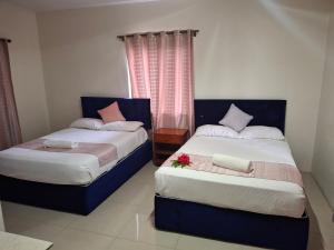 Postel nebo postele na pokoji v ubytování Tavua Hotel Ismail Investments