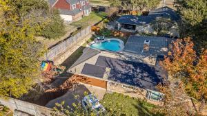 an overhead view of a house with a swimming pool at Your Home Away from Home in Grand Prairie