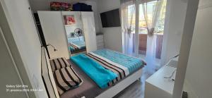 Postel nebo postele na pokoji v ubytování Apartman City Mall