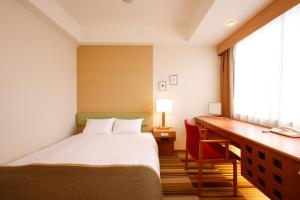 Postel nebo postele na pokoji v ubytování Hotel the Lutheran