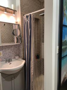 a bathroom with a sink and a shower at Stylish City Escape in Toronto +45 photos