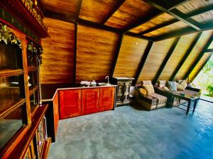 a living room with a sink and a couch at Agora Field in Hikkaduwa