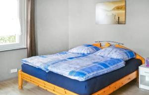 Ein Bett oder Betten in einem Zimmer der Unterkunft Ferienhaus Mirow Ot Qualzow