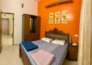 En eller flere senge i et værelse på Sree Padmanabha Heritage Trivandrum