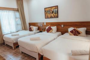 Katil atau katil-katil dalam bilik di Jungle Safari Lodge- Serenity in the Wild
