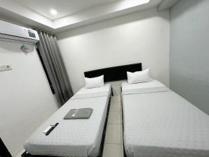 Postel nebo postele na pokoji v ubytování Ghaza Guest House