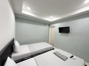 Postel nebo postele na pokoji v ubytování Ghaza Guest House