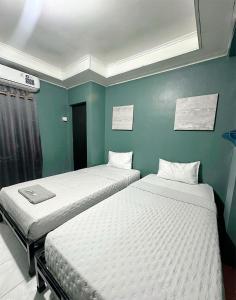 Postel nebo postele na pokoji v ubytování Ghaza Guest House