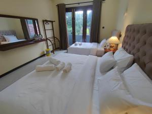 Postel nebo postele na pokoji v ubytování Villa Infinity Negombo