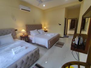 Postel nebo postele na pokoji v ubytování Villa Infinity Negombo