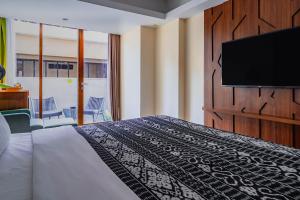TV a/nebo společenská místnost v ubytování MaxOneHotels at Ubud - CHSE Certified