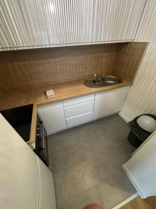 a small bathroom with a sink in a room at Comme à la maison in Saint-Brieuc