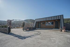 a small house with a garage and a roller coaster at Gyeongju Davulchon Pension in Gyeongju
