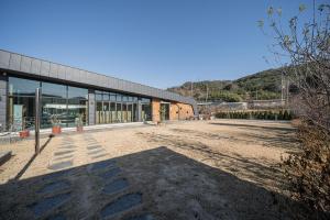 a large building with a large yard in front of it at Gyeongju Davulchon Pension in Gyeongju +4 photos