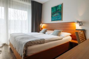 Postel nebo postele na pokoji v ubytování Hotel Rakar
