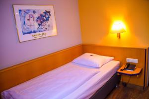 Posteľ alebo postele v izbe v ubytovaní Hotel Strohofer