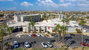 an aerial view of a parking lot with parked cars at Radisson Hotel Casa Grande in Casa Grande