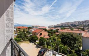 a view of a town from a balcony of a city at Apartments Bernardeta 1 in Baška