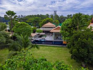 an aerial view of a house with a yard at Banyan Tree Grand Residences by Banyan Living in Phuket Town