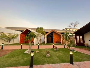 Κήπος έξω από το THE O-ZONE AIRPORT Riviera Lodge