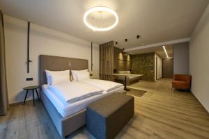 Ένα ή περισσότερα κρεβάτια σε δωμάτιο στο LH Suites Aparthotel NEW OPENING inkl JokerCard