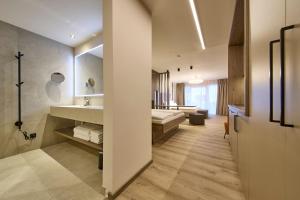Ένα ή περισσότερα κρεβάτια σε δωμάτιο στο LH Suites Aparthotel NEW OPENING inkl JokerCard