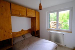 Postel nebo postele na pokoji v ubytování Gite des Rosiers