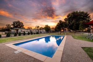 a swimming pool in the yard of a home at BIG4 Red Cliffs Caravan Park in Red Cliffs