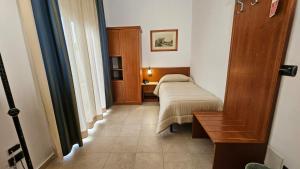 Postel nebo postele na pokoji v ubytování GH Hotel