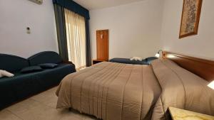 Postel nebo postele na pokoji v ubytování GH Hotel
