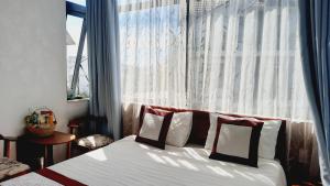 Postel nebo postele na pokoji v ubytování NEST House