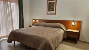 Postel nebo postele na pokoji v ubytování GH Hotel