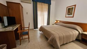 TV a/nebo společenská místnost v ubytování GH Hotel