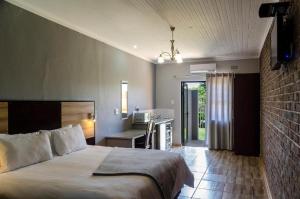 Ένα ή περισσότερα κρεβάτια σε δωμάτιο στο The Woodsman Bed and Breakfast