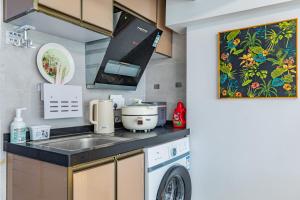 Küche/Küchenzeile in der Unterkunft Guangzhou City Center Apartment