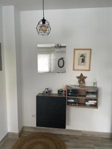 Telewizja i/lub zestaw kina domowego w obiekcie Pedregalejo Beach House