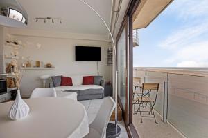 a living room with a view of the ocean at Atlantis 0102 in Sint-Idesbald