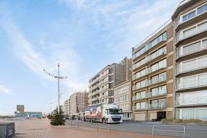 a truck parked in front of a building at Atlantis 0102 in Sint-Idesbald