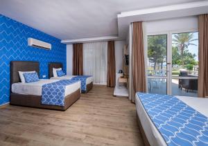 Postel nebo postele na pokoji v ubytování Amara Comfort Resort