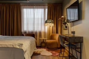 Postel nebo postele na pokoji v ubytování Best Western Plus Grand Hotel Elektra + 37 fotografií