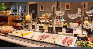 a buffet of food on display in a store at PLAZA Premium Grand Winston in Rijswijk