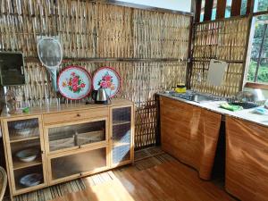 a kitchen with a counter and a sink at Nana Pai in Pai