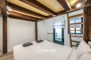 Ein Bett oder Betten in einem Zimmer der Unterkunft MyHouseSpain - Great apartment 6 PAX MADRID CITY CENTER